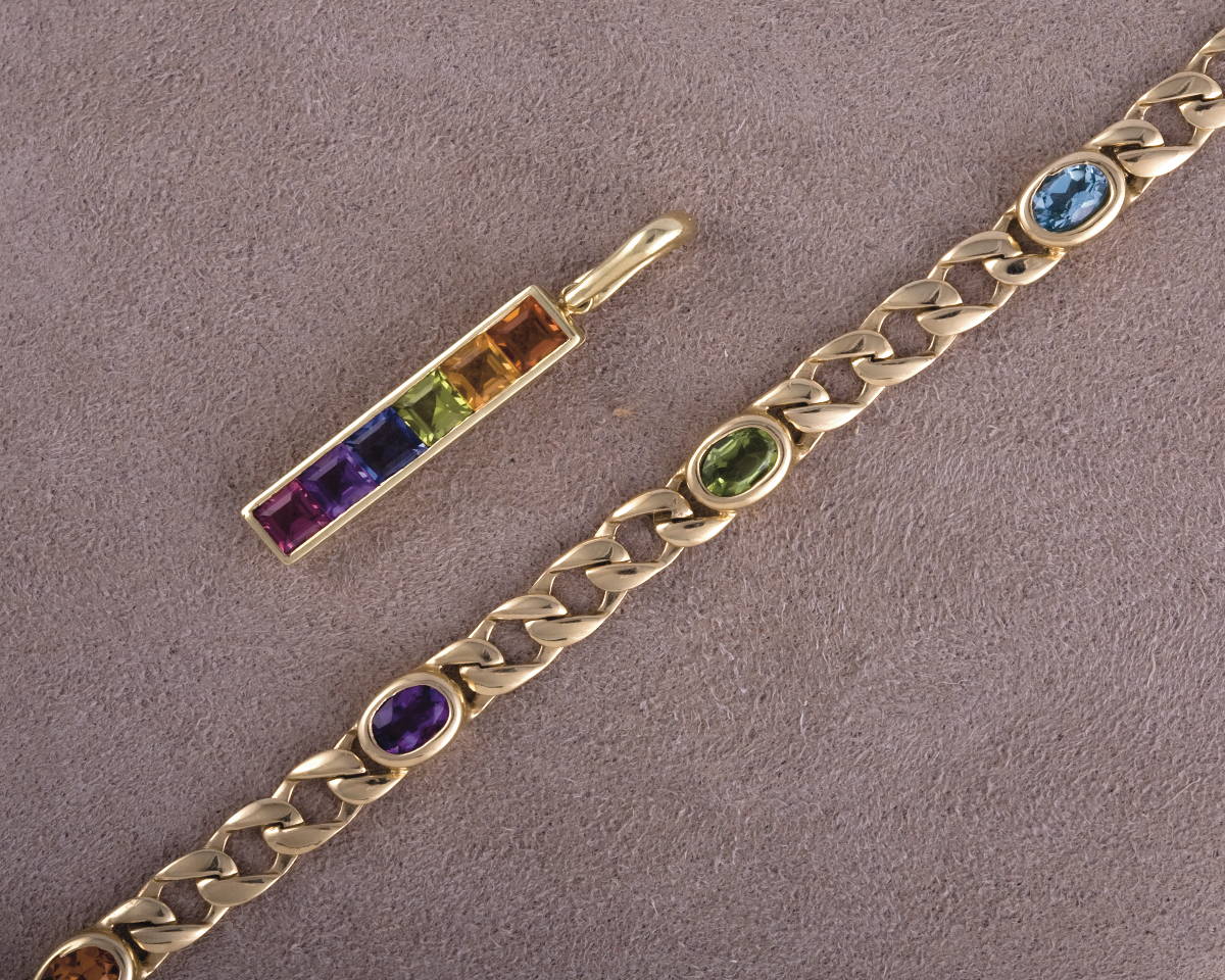 Appraisal: GOLD AND RAINBOW STONE PENDANT AND COORDINATING BRACELET