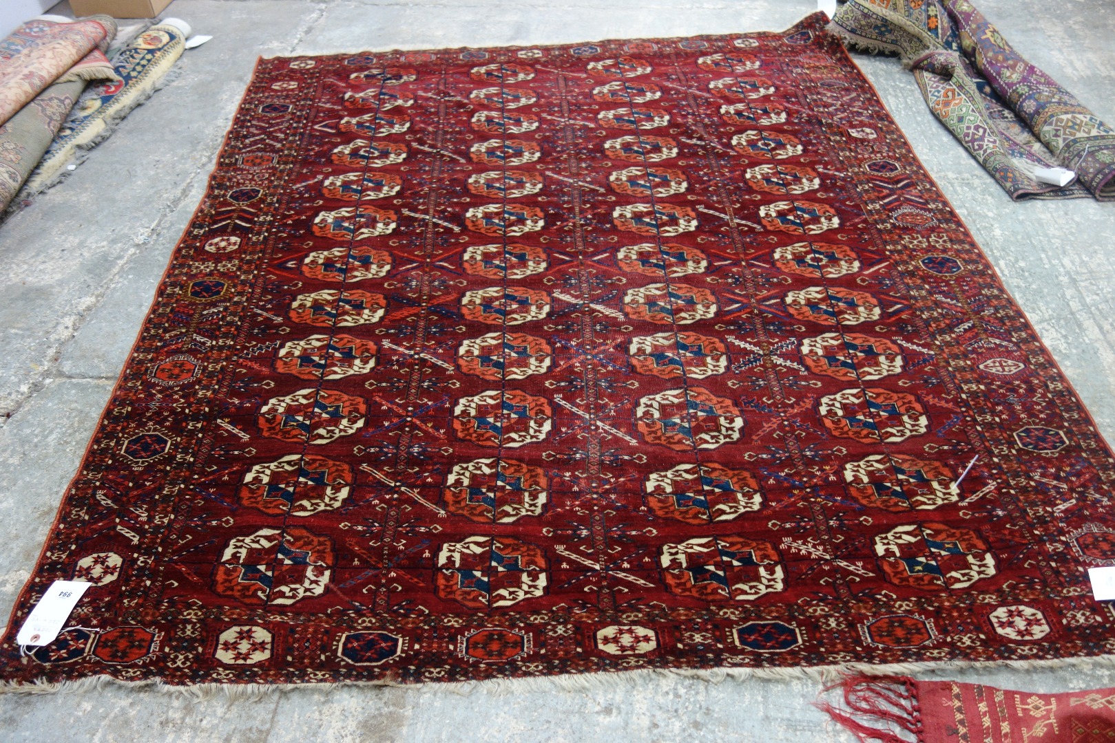 Appraisal: A Tekke Turkman carpet the madder field with four columns