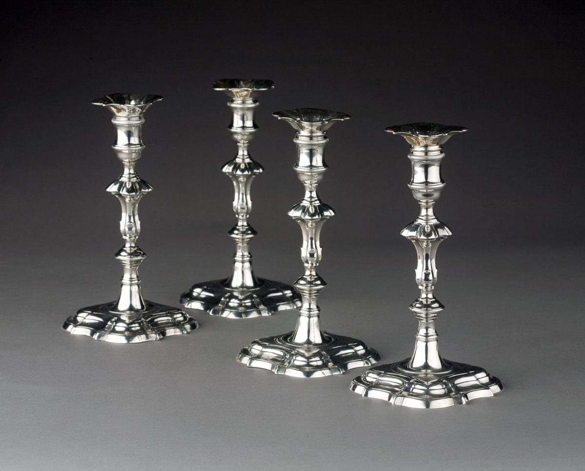 Appraisal: SET OF FOUR GEORGE II SILVER ARMORIAL CANDLESTICKS LONDON -