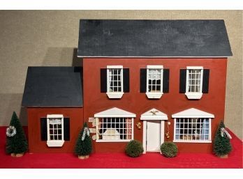 Appraisal: A vintage hand built dollhouse with many accessories and characters