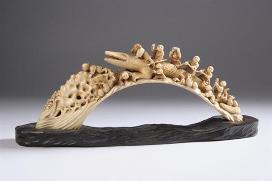 Appraisal: JAPANESE IVORY OKIMONO Carved to depict figures - in long