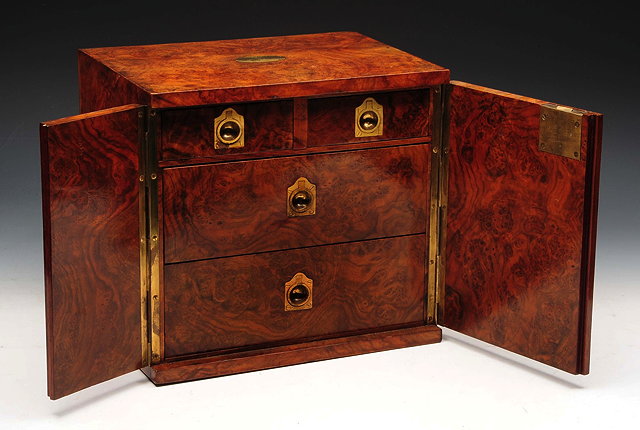 Appraisal: A VICTORIAN FIGURED WALNUT CIGAR HUMIDOR the interior fitted two