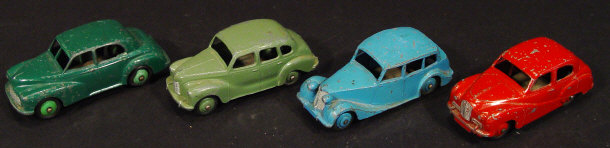 Appraisal: Four Dinky Toys die-cast British saloon cars comprising an Austin