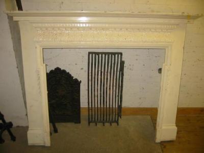 Appraisal: A CARVED PINE FIRE SURROUND of Georgian design the rectangular