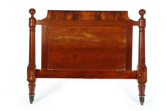 Appraisal: EMPIRE CLASSICAL BED American th century Mahogany and flame veneer