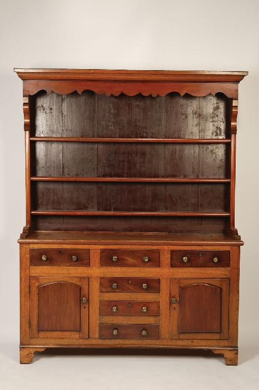 Appraisal: A VICTORIAN OAK AND MAHOGANY DRESSER the raised back with