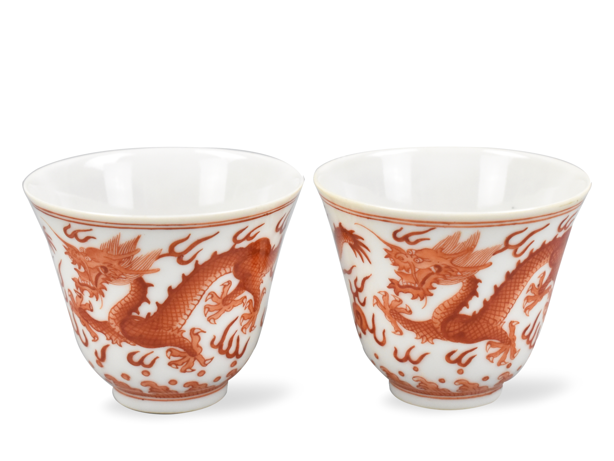 Appraisal: A pair of Chinese gilt iron red dragon cups Guangxu