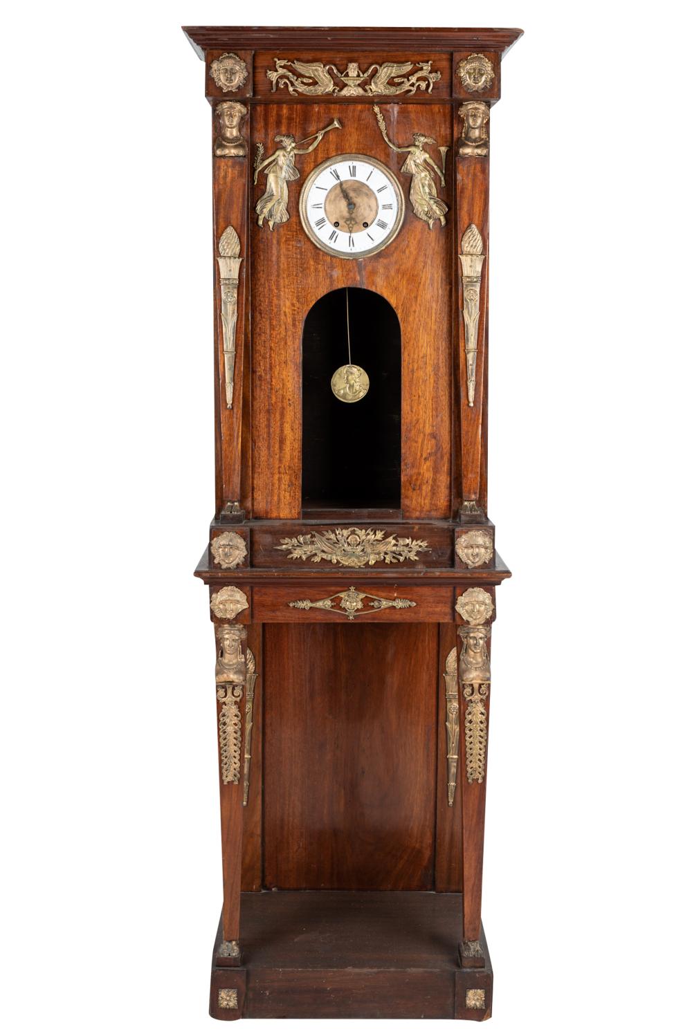 Appraisal: EMPIRE STYLE CLOCK ON STANDunsigned with movement and pendulum Condition