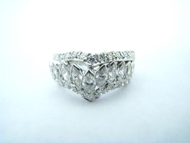 Appraisal: A vintage platinum diamond ring with three rows of diamonds