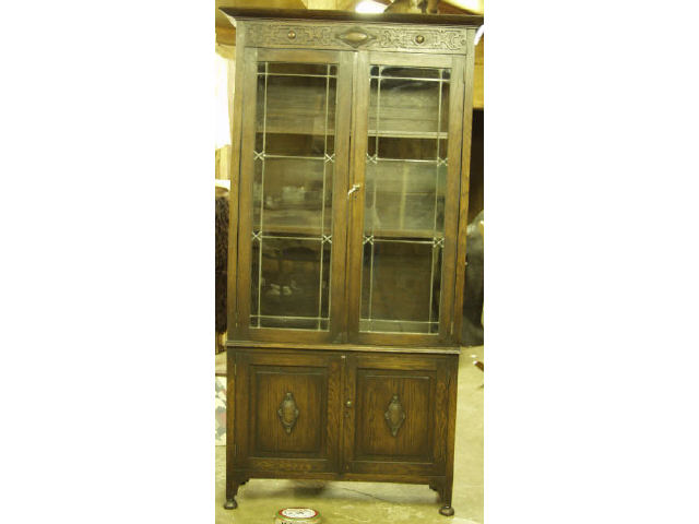 Appraisal: English oak two door bookcase with leaded glass door over