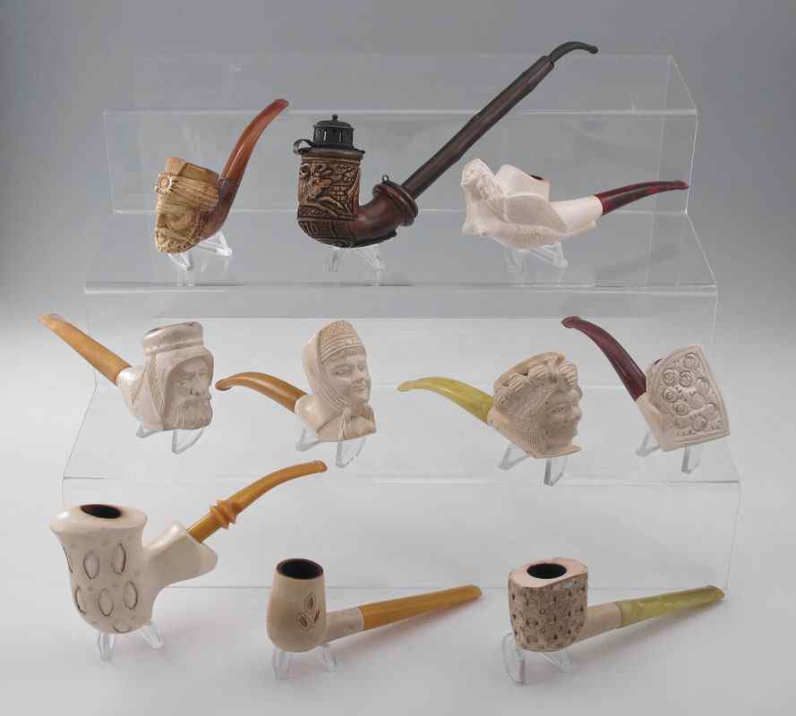 Appraisal: COLLECTION OF MEERSCHAUM PIPES Assorted carved bowls including figural mermaid