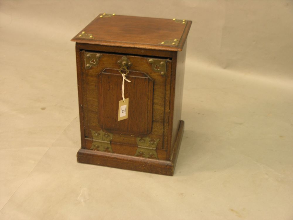 Appraisal: A late Victorian walnut coal box fall front with brass