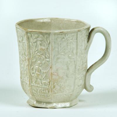 Appraisal: A STAFFORDSHIRE SALTGLAZE STONEWARE COFFEE CUP mid th century with