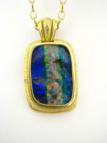 Appraisal: A K yellow gold pendant with rare boulder opal stone