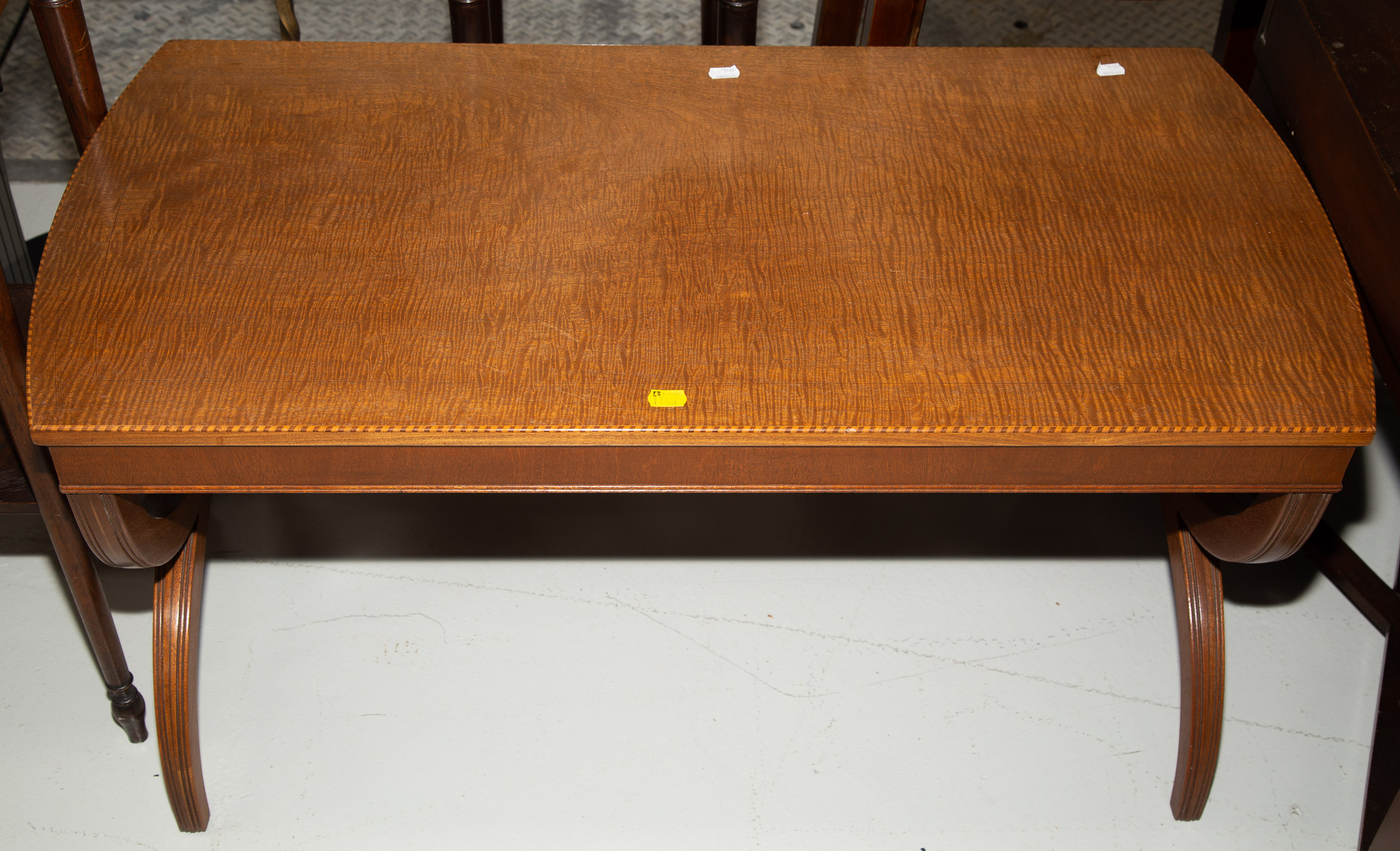 Appraisal: REGENCY STYLE FIGURED MAHOGANY COFFEE TABLE Mid th century in