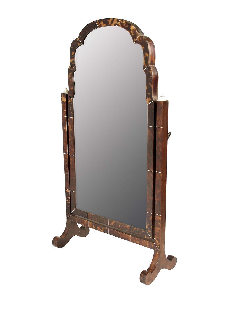 Appraisal: A tortoiseshell and ivory dressing table mirror