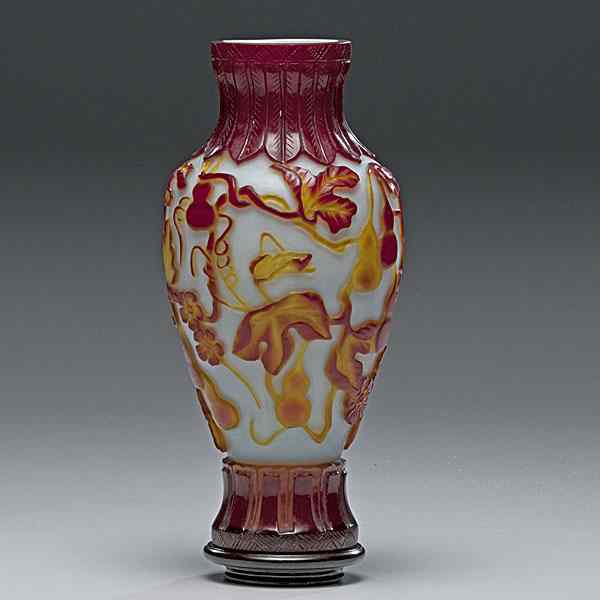 Appraisal: Red Agate Covered Peking Glass Vase Chinese a red agate