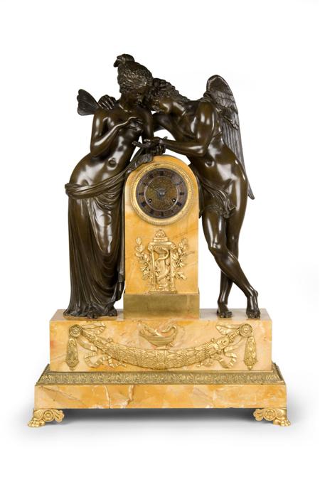 Appraisal: A large French Siena marble and parcel-gilt-bronze mantel clock in