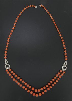 Appraisal: A coral bead necklace the double lower row joined with