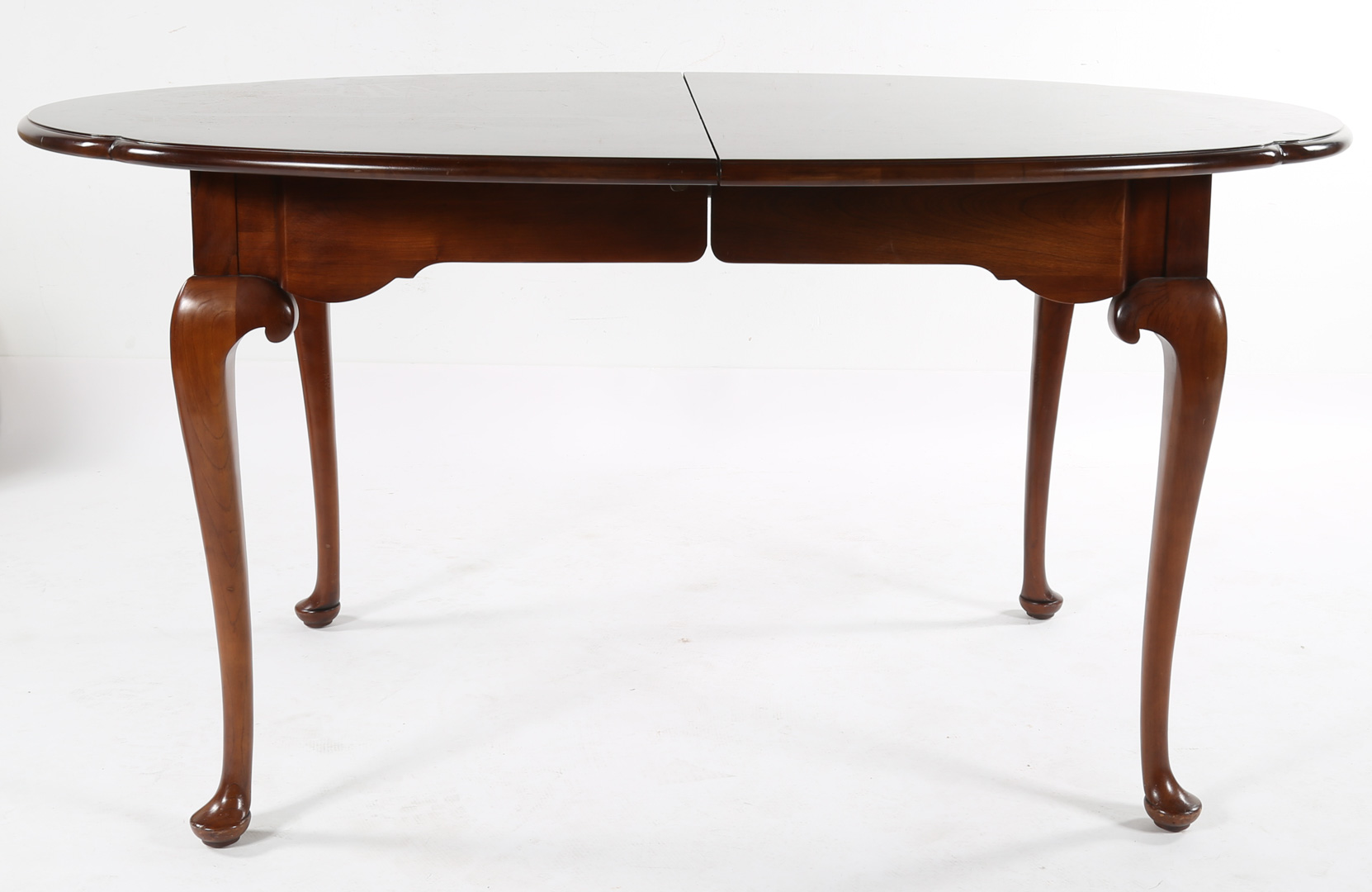 Appraisal: Cherry oval dining table with two leaves Undernumber