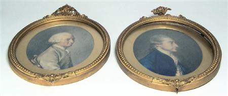 Appraisal: A pair of th century school watercolour portraits of gentleman