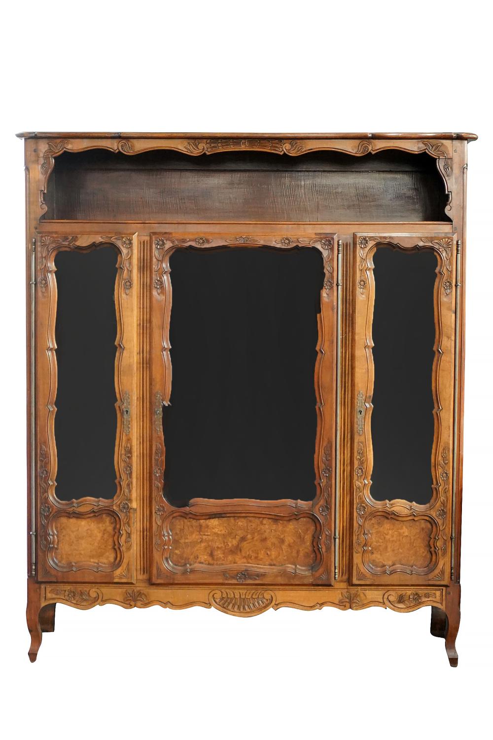 Appraisal: FRENCH PROVINCIAL FRUITWOOD DISPLAY CABINEThaving a shelf over three glazed