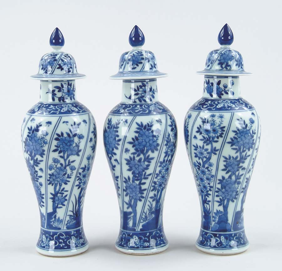 Appraisal: SET OF THREE BALUSTER FORM COVERED JARS Blue and white