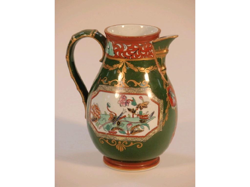 Appraisal: An Ashworths ironstone baluster jug with a bamboo moulded handle