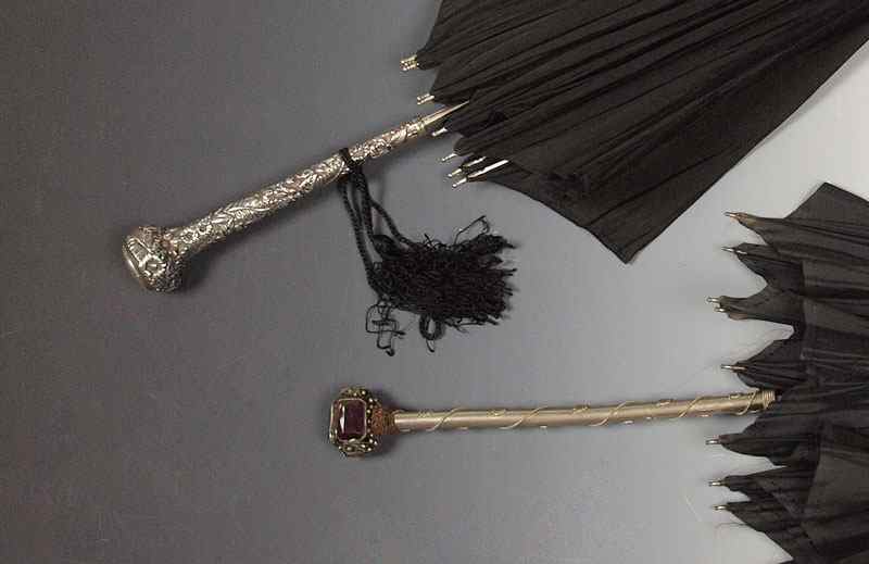 Appraisal: LATE VICTORIA UMBRELLAS ONE WITH STERLING REPOUSSE HANDLE Ornate sterling