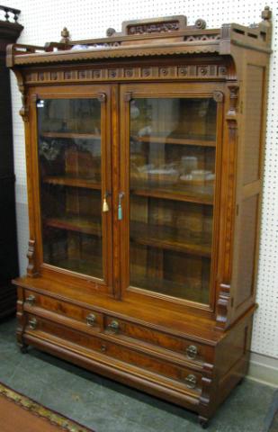 Appraisal: Eastlake Victorian Step-Back Bookcase double glass doors carved pediment and