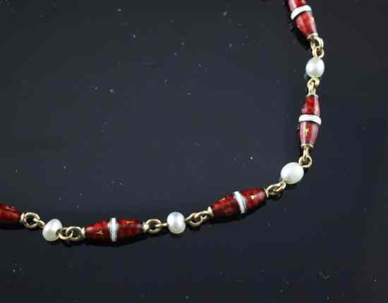 Appraisal: A red and white enamelled gold and seed pearl bracelet