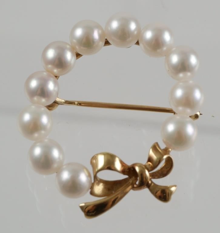 Appraisal: Set in K yellow gold with fine luster pearls and