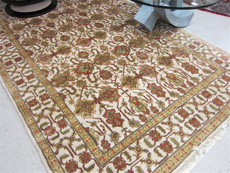 Appraisal: HAND KNOTTED ORIENTAL CARPET Indo-Persian overall floral design on cream