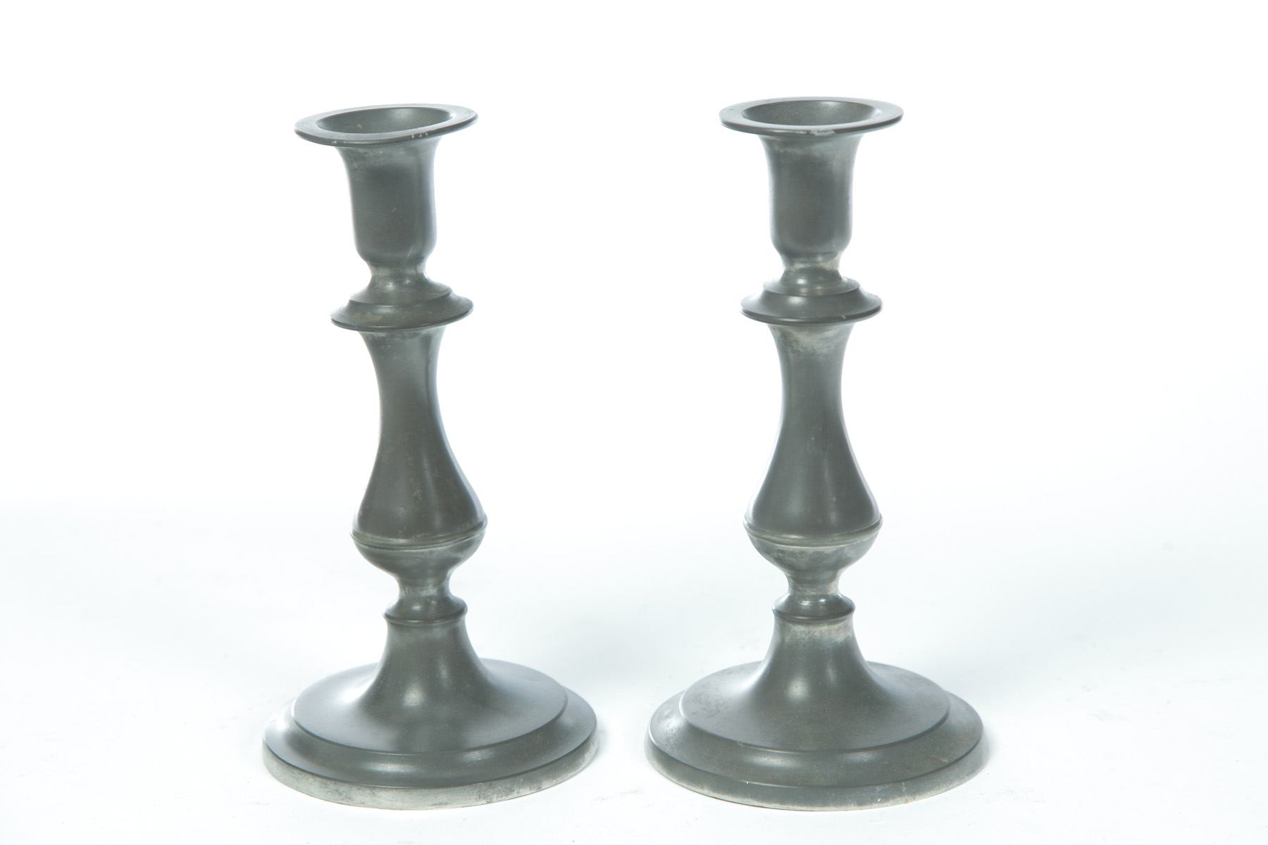 Appraisal: PAIR OF MARKED FLAGG HOMAN CINCINNATI OHIO PEWTER CANDLESTICKS Mid