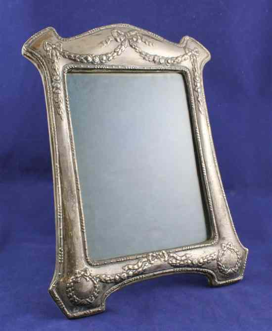 Appraisal: A George V silver photograph frame of shaped rectangular form