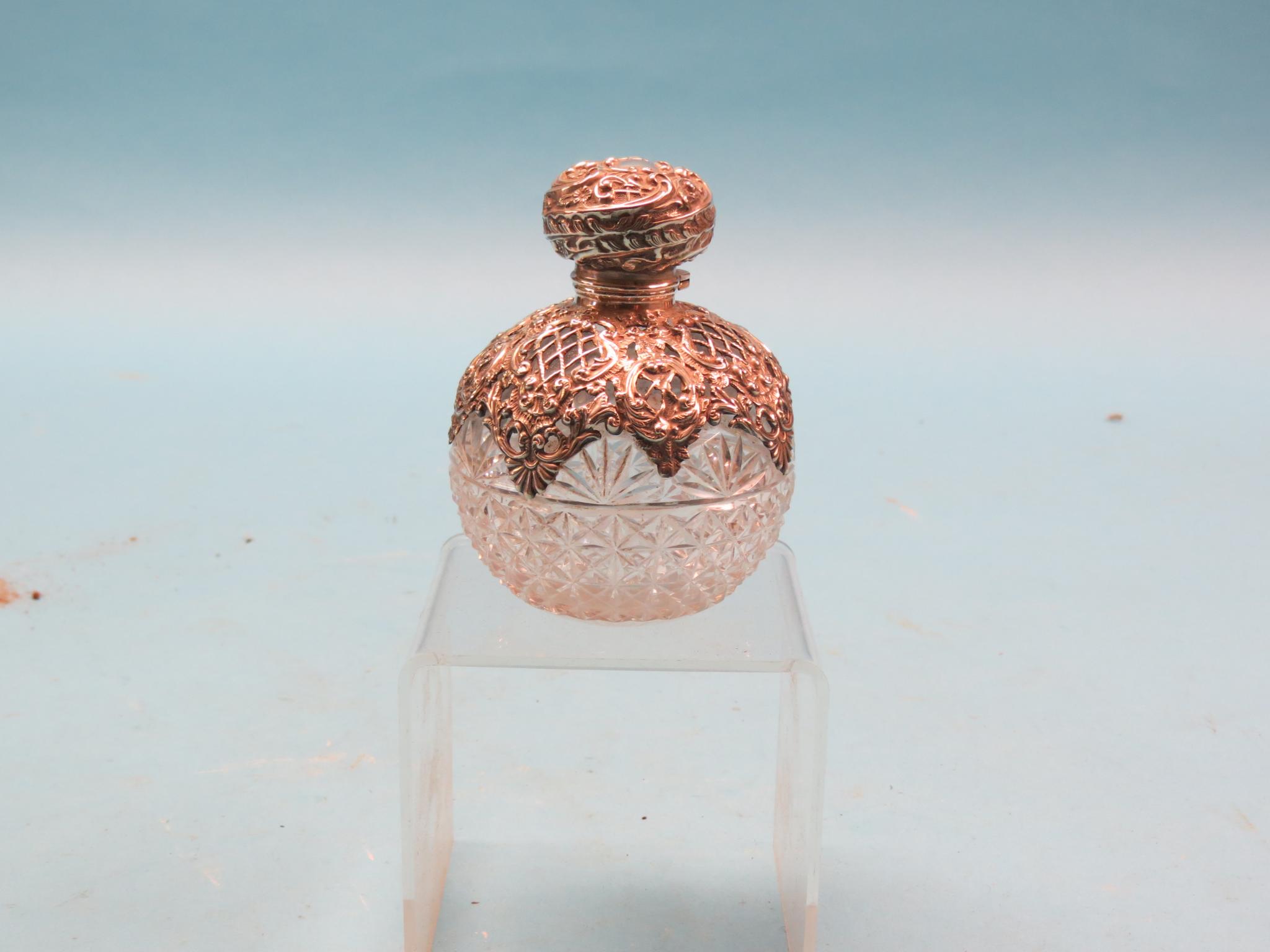 Appraisal: A late Victorian cut glass scent bottle globular-shape with elaborate