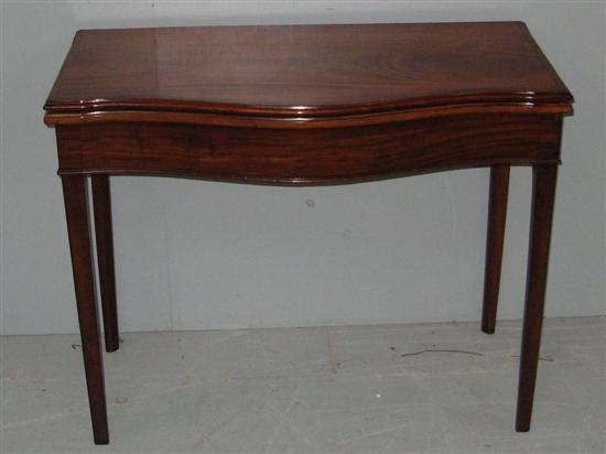 Appraisal: Early th century mahogany and brass inlaid serpentine card table