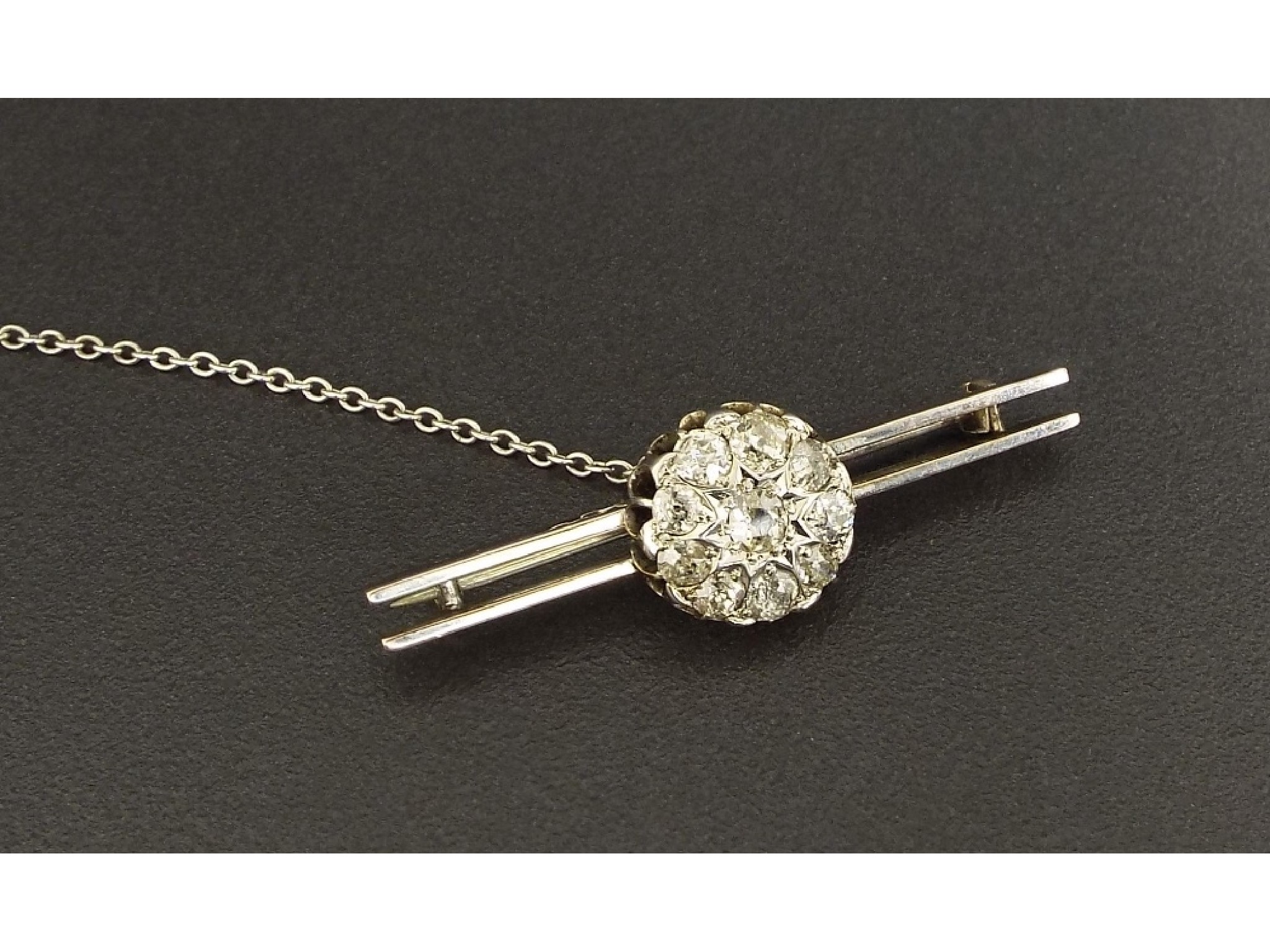 Appraisal: Circular diamond cluster bar brooch set with ten old cut