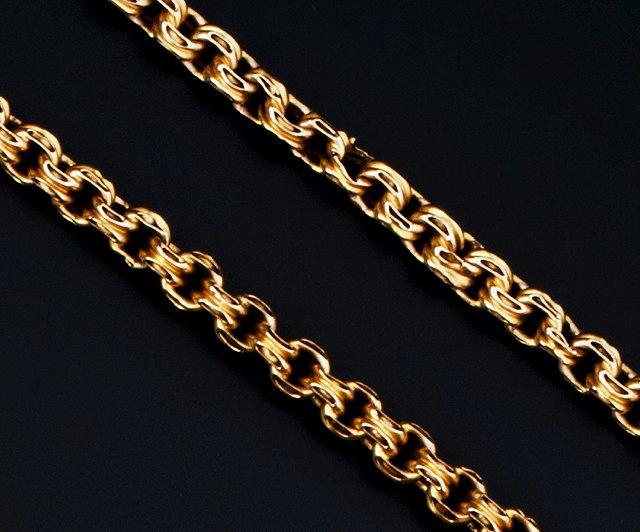 Appraisal: A FANCY-LINK LONG CHAIN AND A BRACELET the yellow precious