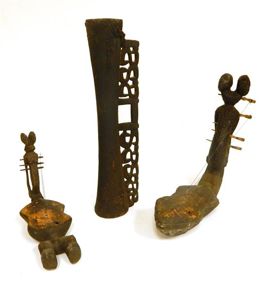 Appraisal: TRIBAL Three African instruments two similar figural lutes from unknown