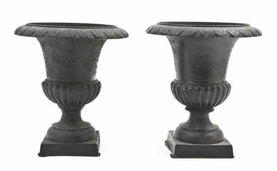 Appraisal: A Pair of Cast Iron Urns of baluster form rising