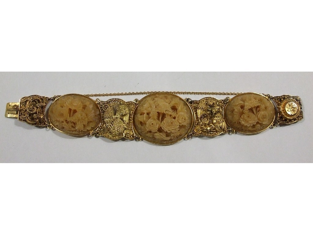 Appraisal: Chinese yellow metal filigree work bracelet with oval foliate carved