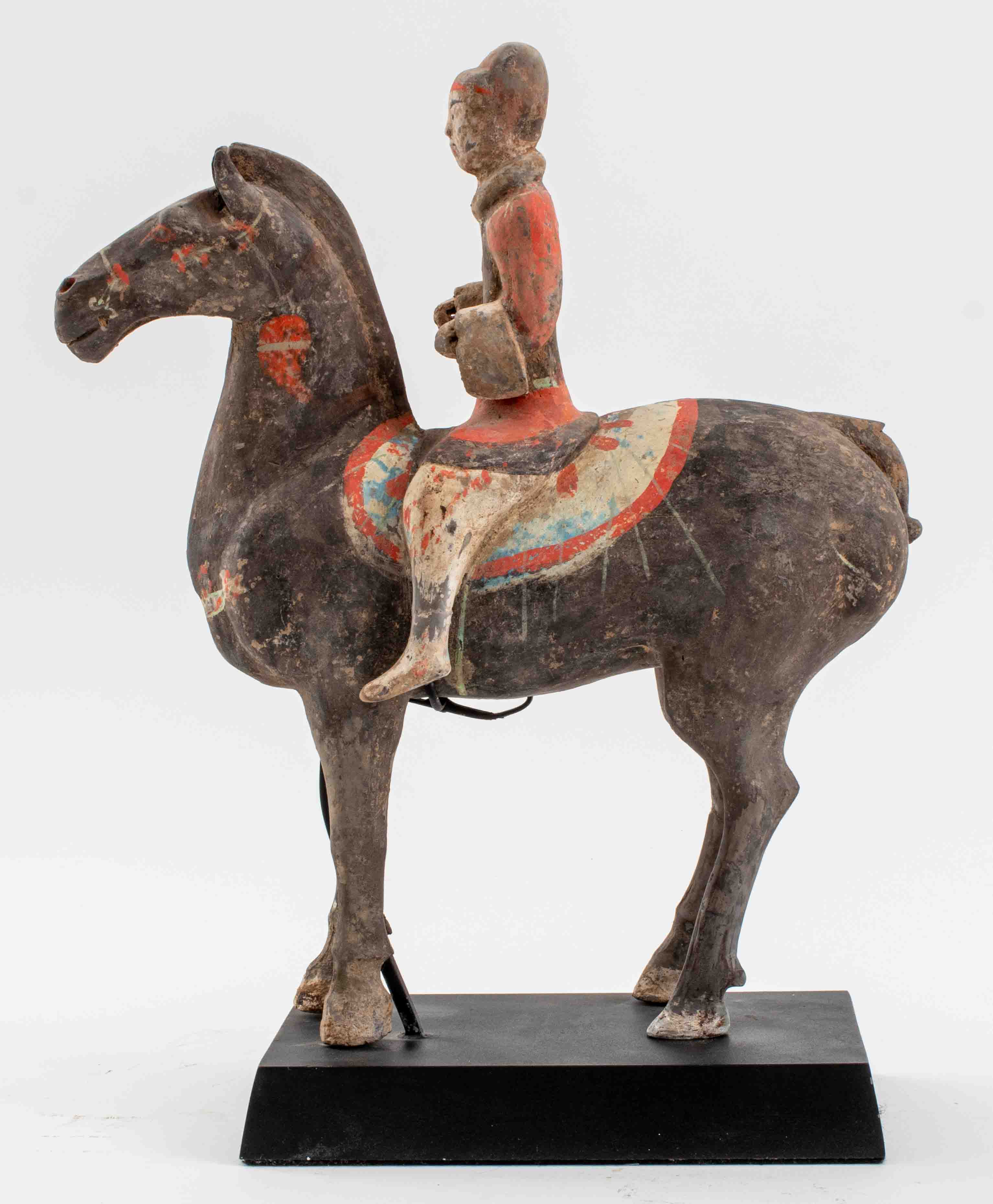 Appraisal: CHINESE PAINTED CERAMIC EQUESTRIAN RIDER STATUE Chinese Han or Tang