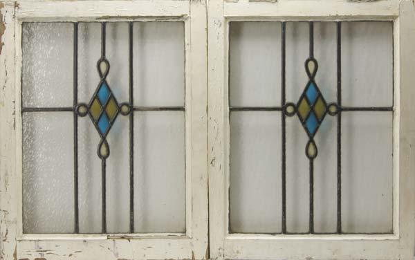 Appraisal: WINDOWS Pair of framed glass windows with stained glass central