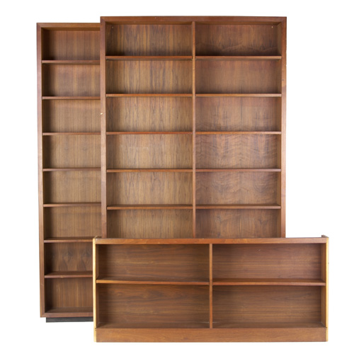 Appraisal: VLADIMIR KAGAN Three walnut veneer bookcases the smallest with illuminated