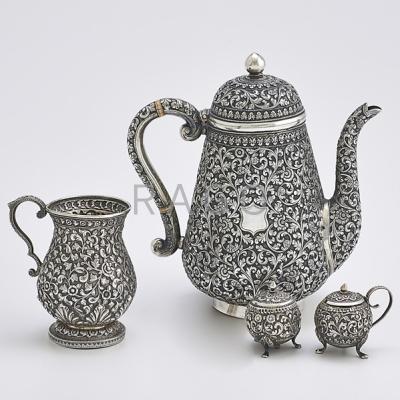 Appraisal: FINE INDO-PERSIAN SILVER HOLLOWARE Four pieces gourd-shaped coffee pot on