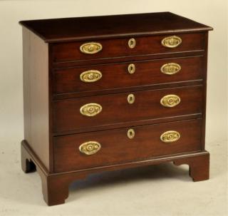 Appraisal: George III Mahogany Bachelor Chest Diminutive George III figured mahogany