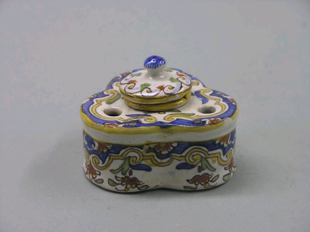 Appraisal: A late th century northern French faience inkstand tre-foil shape