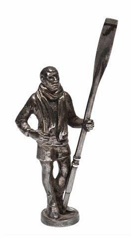 Appraisal: A SILVER FIGURE of an oarsman holding an oar and