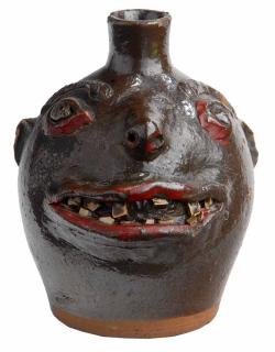 Appraisal: Early Southern Stoneware Face Jug brown glazed face jug applied